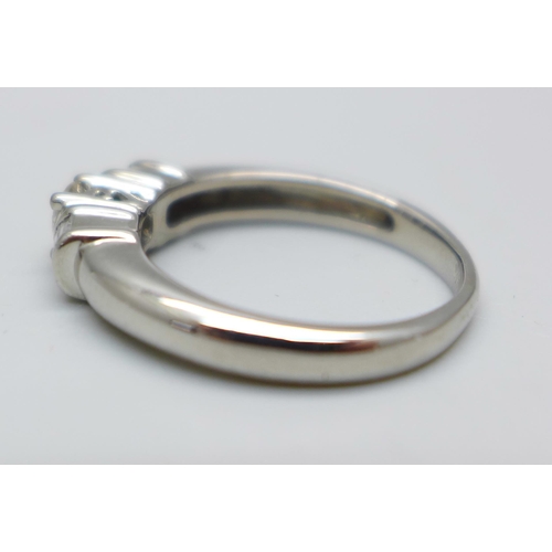 980 - An 18ct white gold and diamond ring, 4.2g, M, centre stone approximately 0.25ct weight