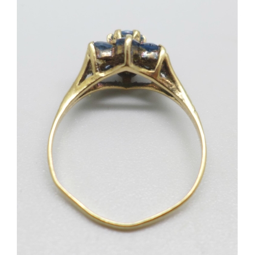 994 - A 9ct gold, seven blue stone flower cluster ring, 1.6g, N