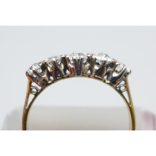 997 - A yellow metal and five stone diamond ring, graduated old cut, approximately 0.70ct diamond weight, ... 