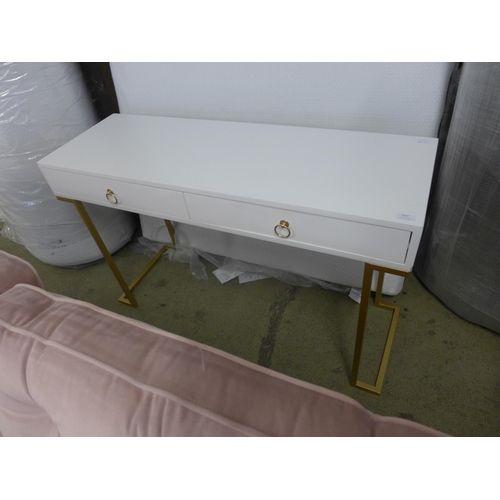 1575 - A white console table with gold legs