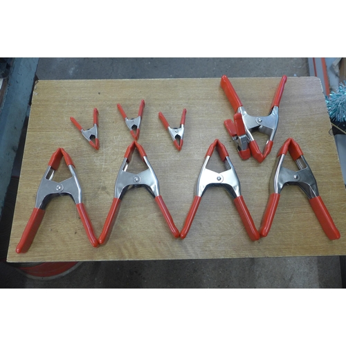 2037 - A tray of nine spring clamps, various sizes