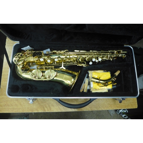 2076 - A Windsor saxophone with spare reeds, polishing cloths and a protective hard case