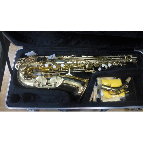 2076 - A Windsor saxophone with spare reeds, polishing cloths and a protective hard case