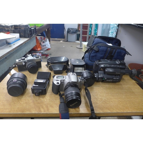 2083 - A quantity of cameras and camera equipment, including a Canon Prakitaca, Sony camcorder lenses and m... 