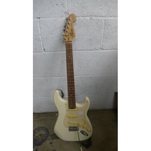 2091 - A Squier Strat by Fender electric guitar