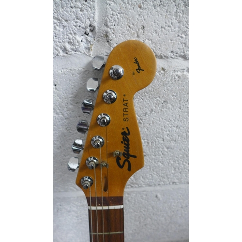 2091 - A Squier Strat by Fender electric guitar