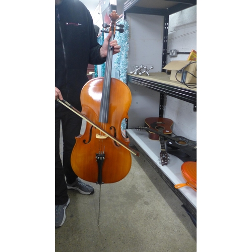 2095 - A cello with bow and a soft case