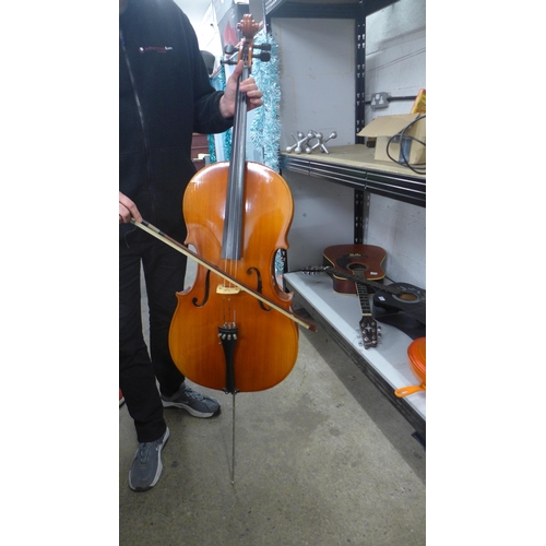 2095 - A cello with bow and a soft case