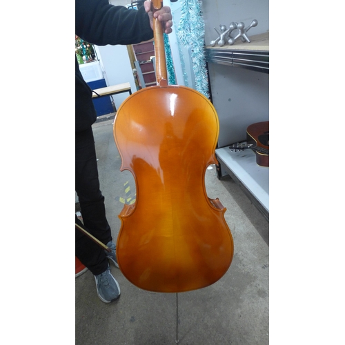 2095 - A cello with bow and a soft case