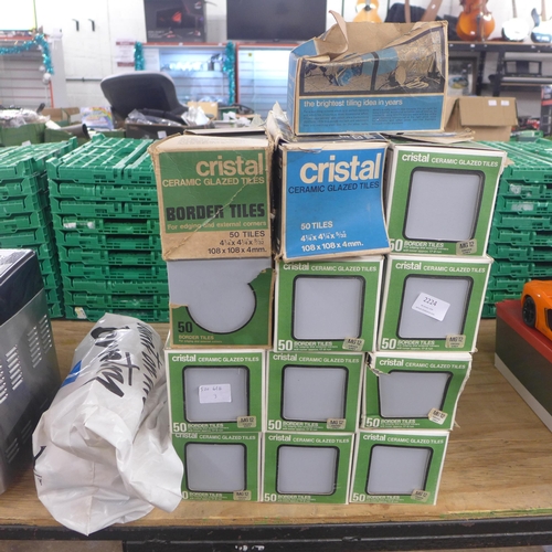 2224 - 12 boxed of Cristal ceramic glazed border tiles and a quantity of spacer tiles