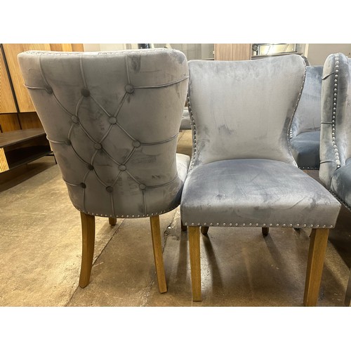 1505 - A pair of grey velvet upholstered button backed side chairs with oak legs *this lot is subject to VA... 