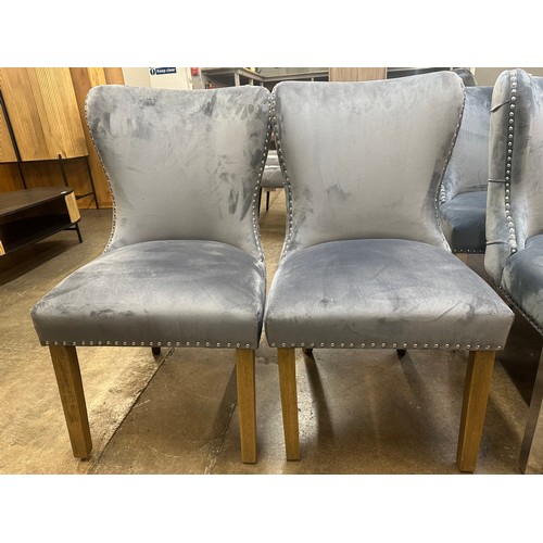 1505 - A pair of grey velvet upholstered button backed side chairs with oak legs *this lot is subject to VA... 