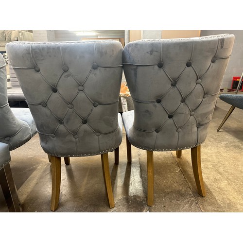 1505 - A pair of grey velvet upholstered button backed side chairs with oak legs *this lot is subject to VA... 