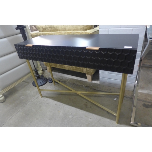 1393 - A black console table with gold legs