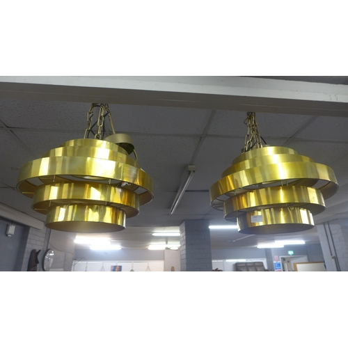 1463 - A pair of gold retro ceiling pendants