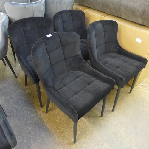 1500 - A set of four Kos black velvet dining chairs * This lot is subject to VAT