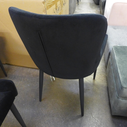 1500 - A set of four Kos black velvet dining chairs * This lot is subject to VAT