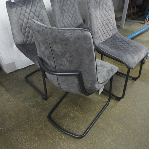 1517 - A set of four grey velvet dining chairs * This lot is subject to VAT