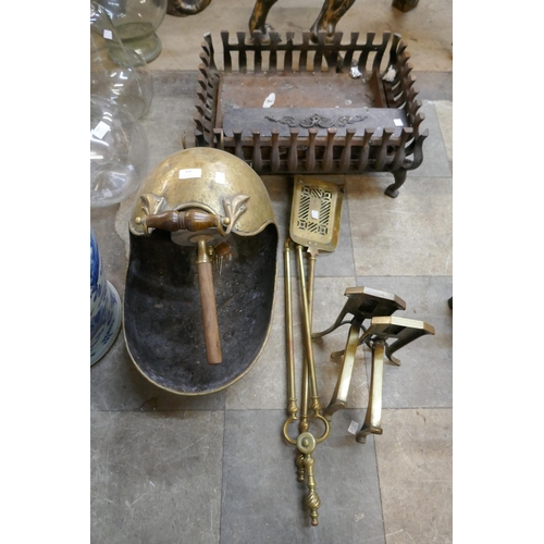 408 - A Victorian brass coal scuttle, a cast iron fire grate and brass companion set