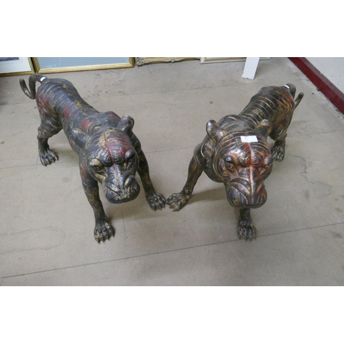 419 - A pair of large bronze tigers of tigers