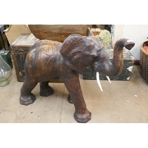 420 - A large leather figure of a baby elephant