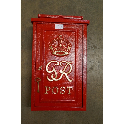 461A - A red painted cast iron Post Office letter box, with key