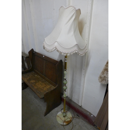 395 - A brass and onyx standard lamp