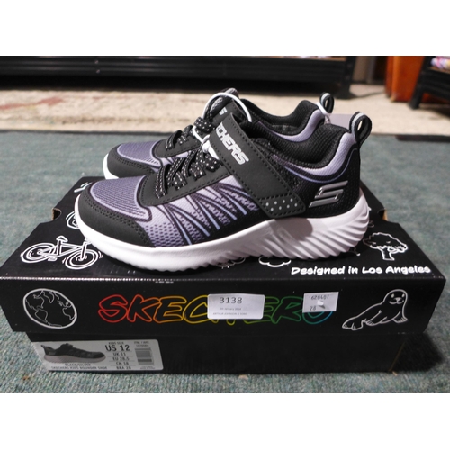 3138 - Pair of kid's black and silver Skechers trainers - size 11 * This lot is subject to VAT