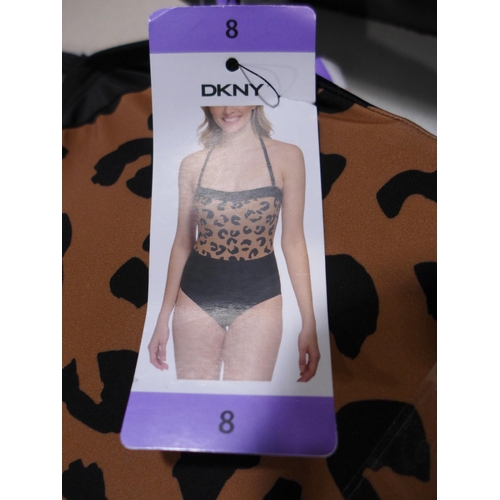 3252 - Five DKNY leopard print swimming costumes, size 8  *This lot is subject to VAT