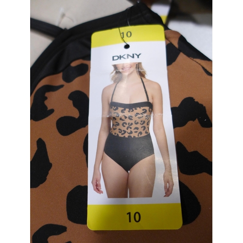 3253 - Five DKNY leopard print swimming costumes, size 10 *This lot is subject to VAT