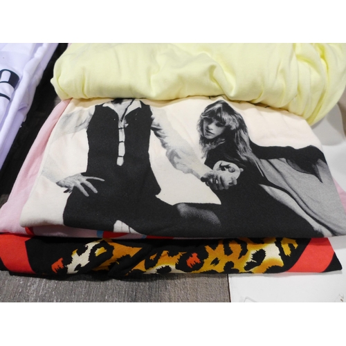 3258 - Four ladies T-Shirts incl. DKNY, mixed sizes, style and colours *This lot is subject to VAT