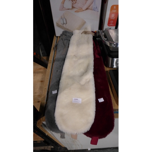 3394 - 2 x Long Hot Water Bottle and a Spare Cover     (311-475)    * This lot is subject to vat