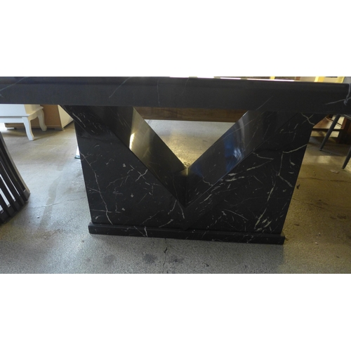 1602 - A black and white marble effect dining table