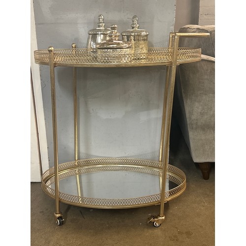 1303 - A gold mirrored drinks trolley