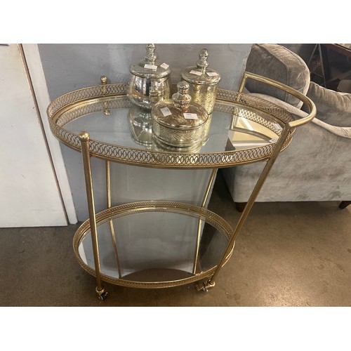 1303 - A gold mirrored drinks trolley