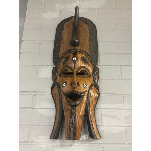 1394 - A pair of large tribal wall art masks