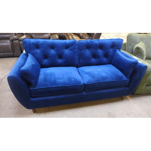 1550 - A Hoxton blue velvet three seater sofa RRP £799