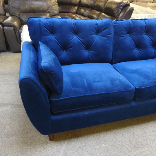 1550 - A Hoxton blue velvet three seater sofa RRP £799