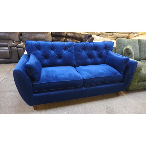 1551 - A Hoxton blue velvet three seater sofa RRP £799