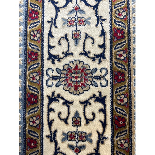 1435 - An ivory ground Cashmere traditional Persian panel deisgn rug, 200cm x 300cm