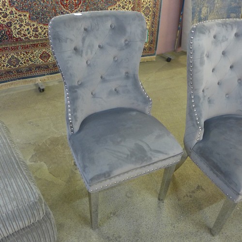 1563 - A set of four grey velvet dining chairs * This lot is subject to VAT