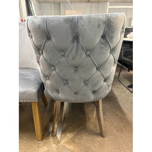 1504 - A pair of grey velvet dining chairs * This lot is subject to VAT