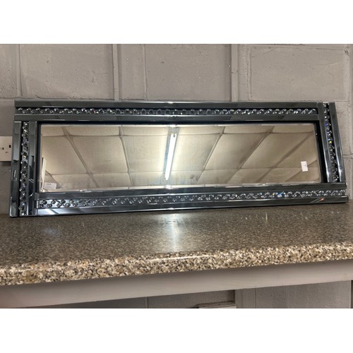 1523 - A smoked glass hall mirror with bevelled edge glass and border filled glass crystals, 120 x 40cms (G... 