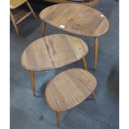 105 - An Ercol Blonde elm and beech pebble shaped nest of tables