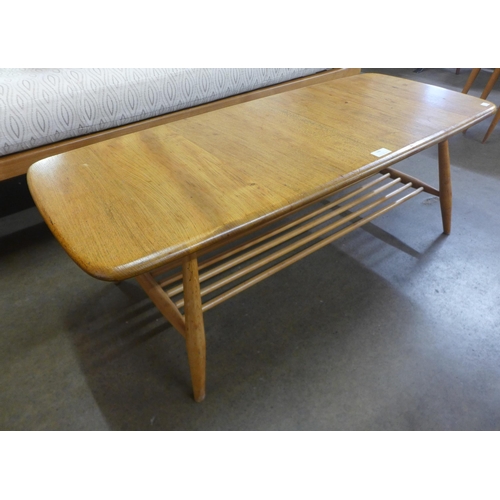 106 - An Ercol Blonde elm and beech Windsor coffee table