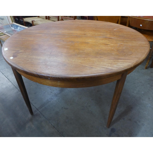 123 - A G-Plan Fresco teak circular extending table