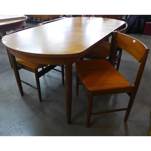 124 - A White & Newton teak extending table and four chairs