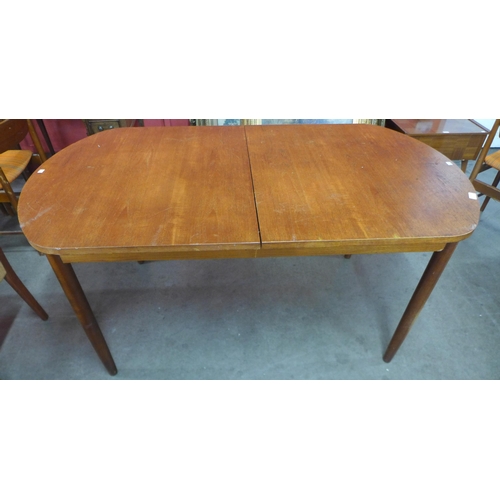 124 - A White & Newton teak extending table and four chairs