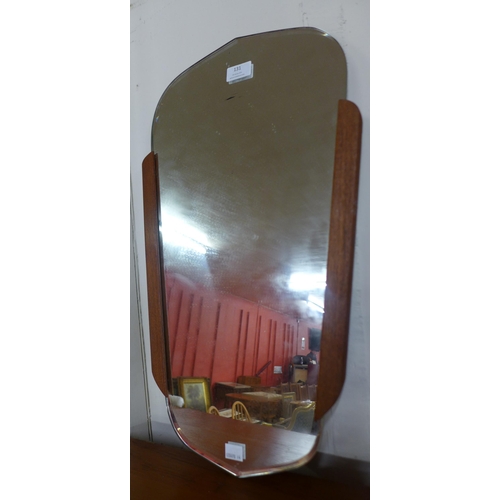 131 - A teak framed mirror