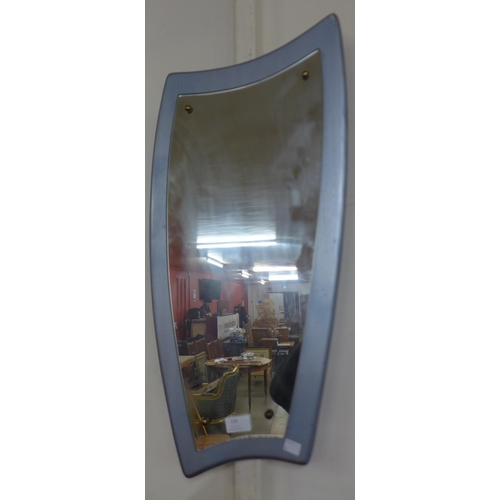 135 - A silver effect asymmetrical framed mirror